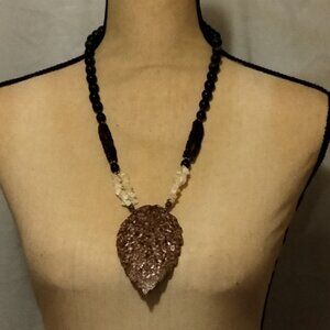 Leaf and bead necklace.